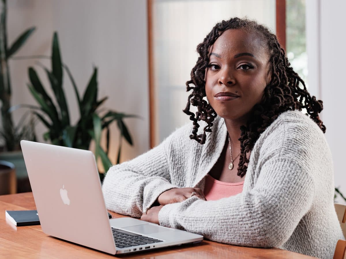 Woman working at a laptop in a bright office