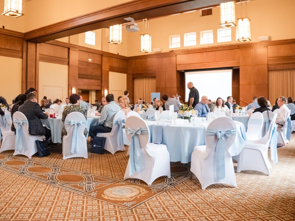 Banquet room filled with guests at an awards luncheon