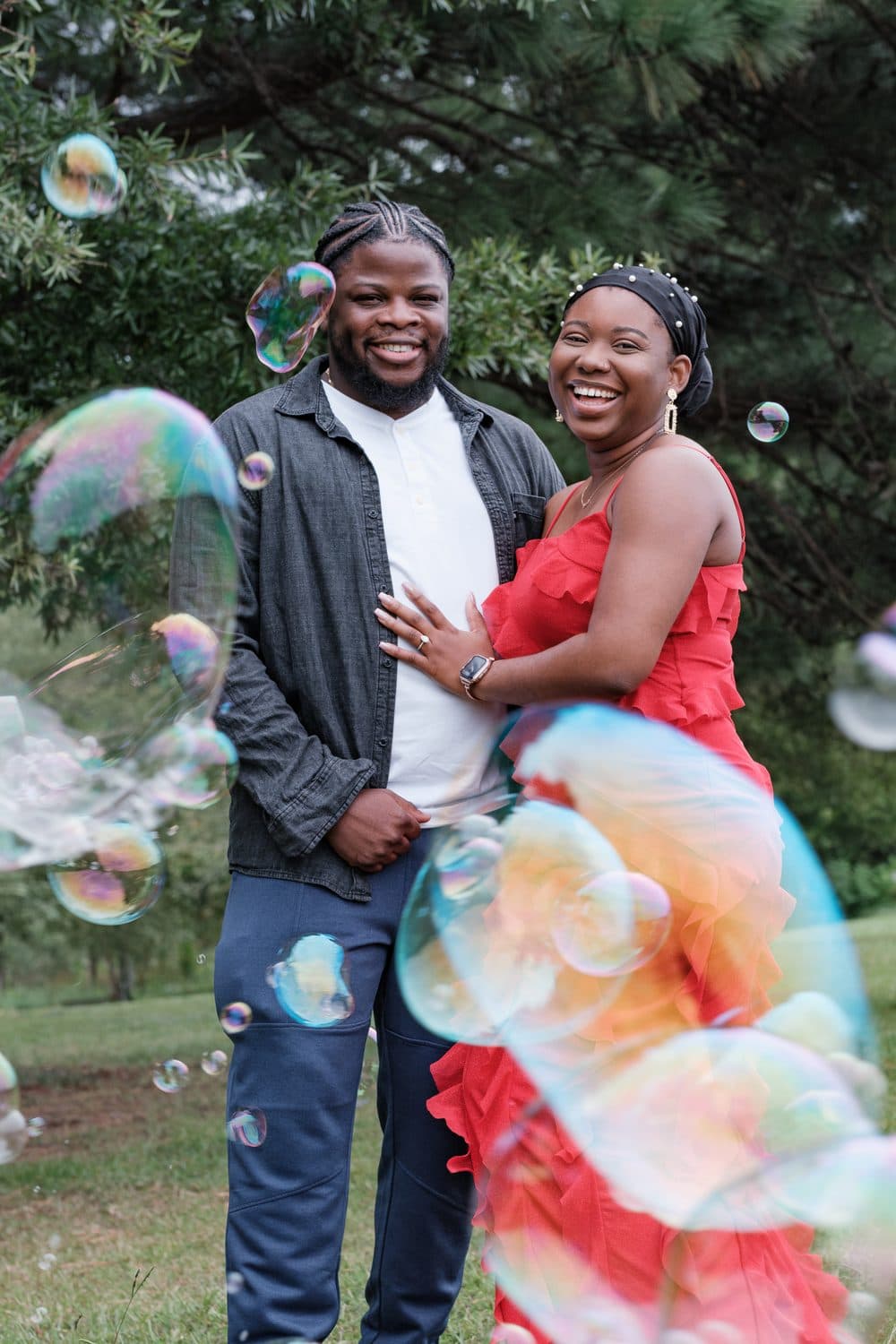 Couple embracing among floating bubbles