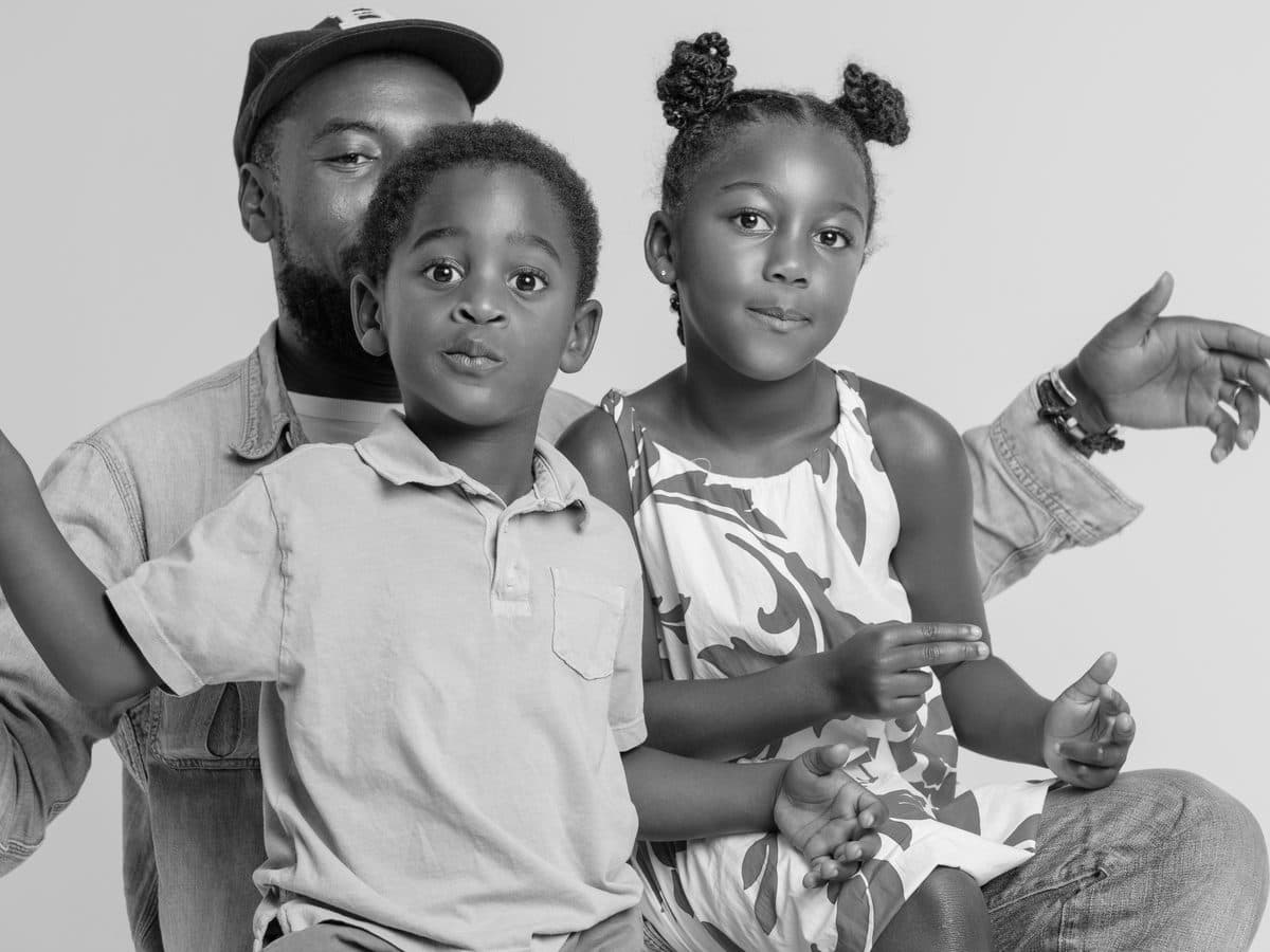 Father and children playfully posing