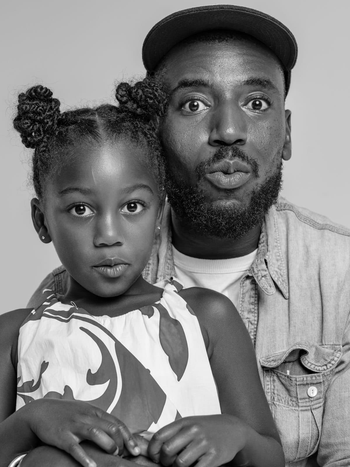 Father and daughter cheek to cheek