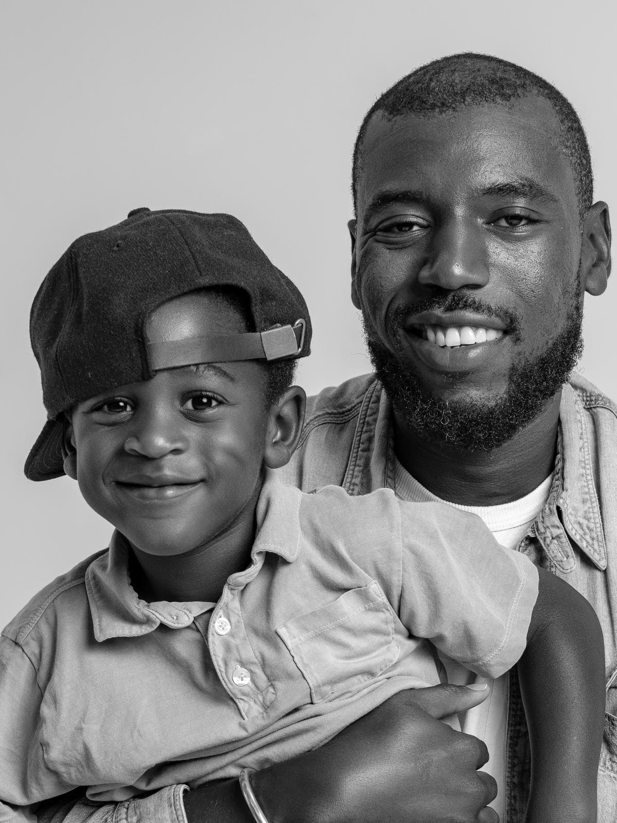 Father and son smiling cheek to cheek