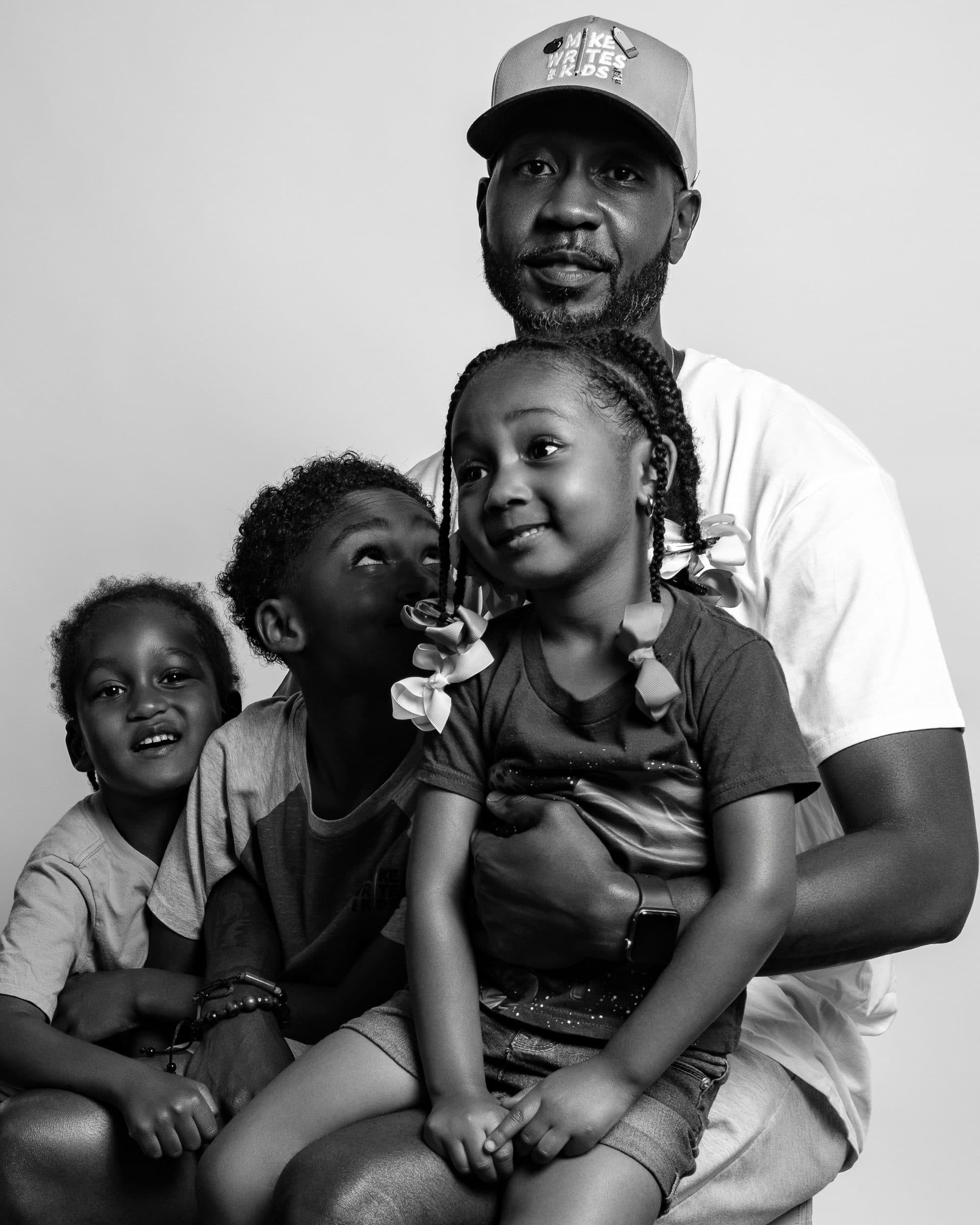 Black father with his children during a family portrait session